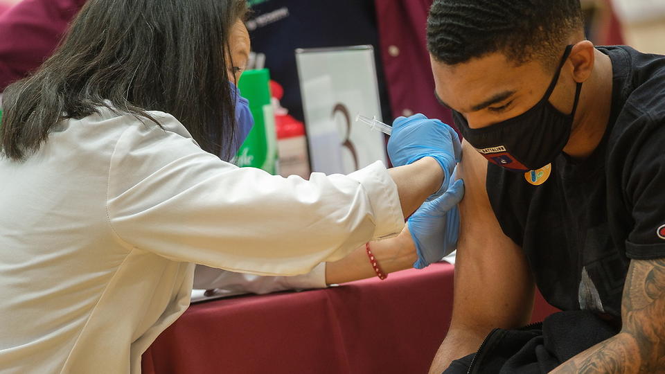 COVID Vaccine Clinic with student and doctor