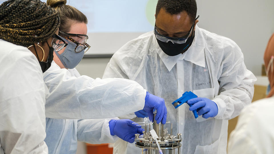 Researcher experimenting in lab