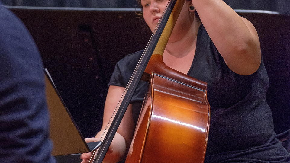 Student playing the cello.