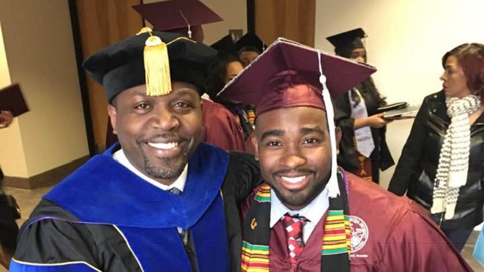 Two graduates posing for a photo together.