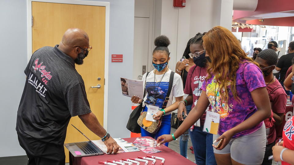 Staff speaking to new students