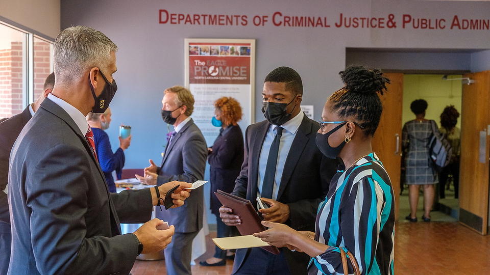 People networking at a Criminal Justice event