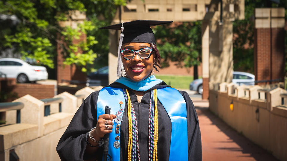 graduate Christie Smith in front of School of Education