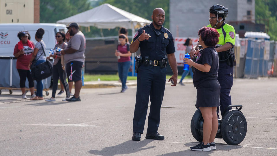 Police conversing with person