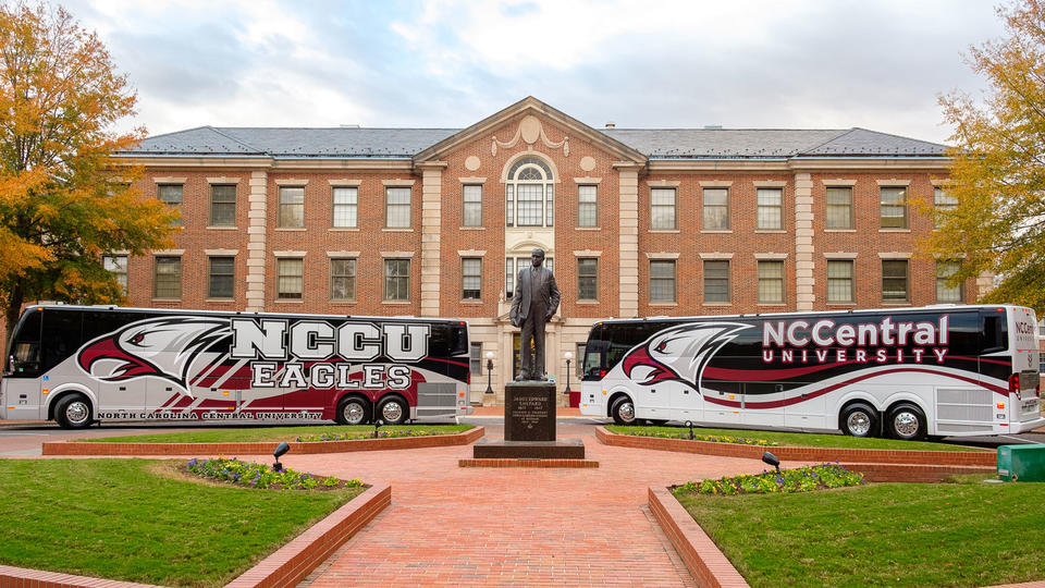 Buses Parked behind James Shepard Statue