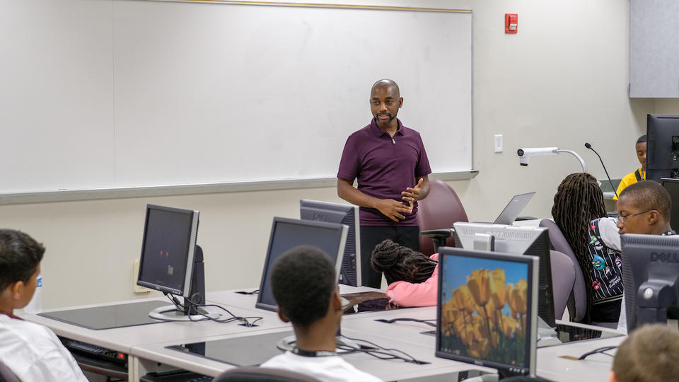Students in a computer lab receiving a lecture