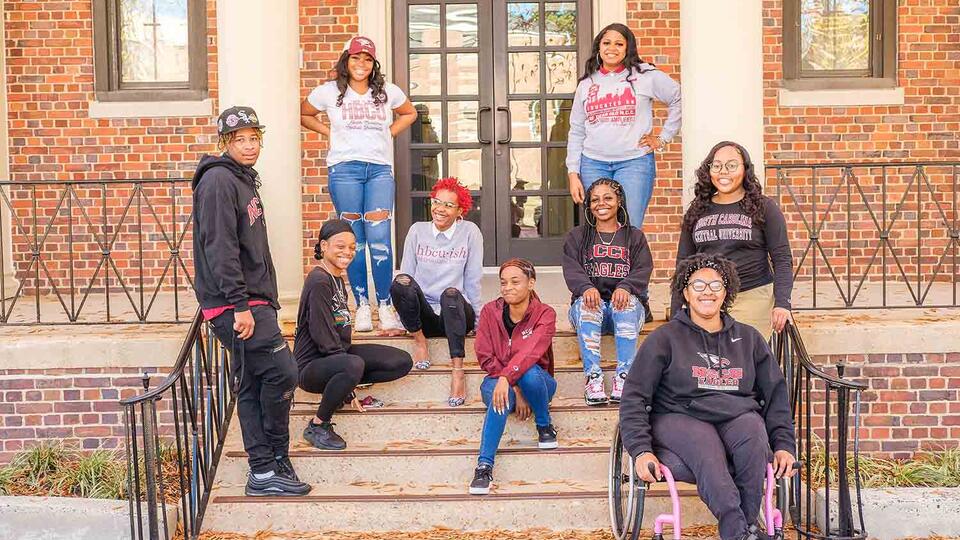 Students standing in front of building