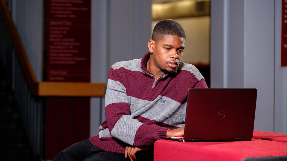 Picture of a student with a laptop