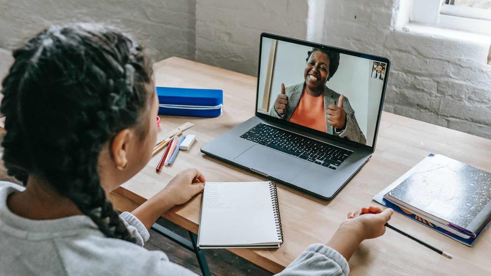 Student with teacher on laptop