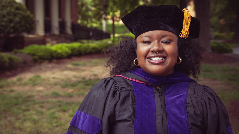 Law School graduate Brittany Reaves standing in front of building