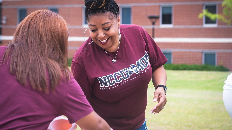 Staff volunteering with student move in