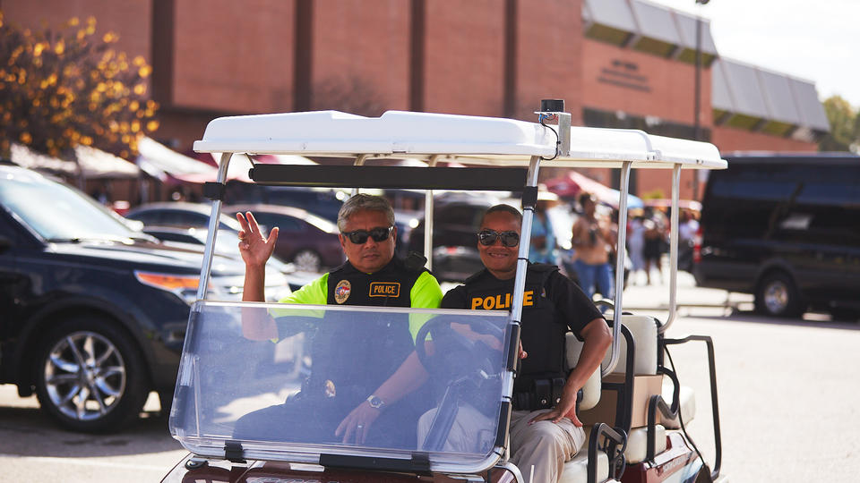 Campus police on golf cart