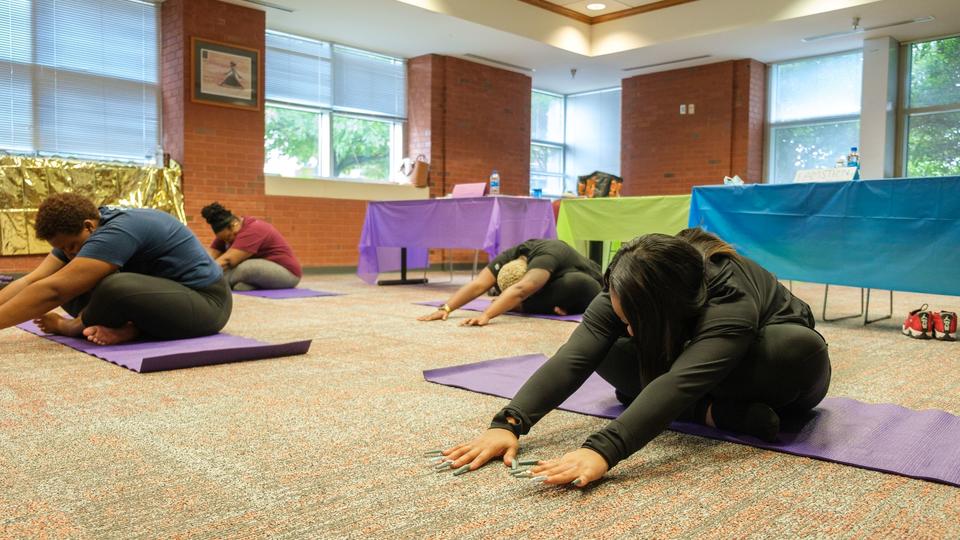 Students stretching in yoga class