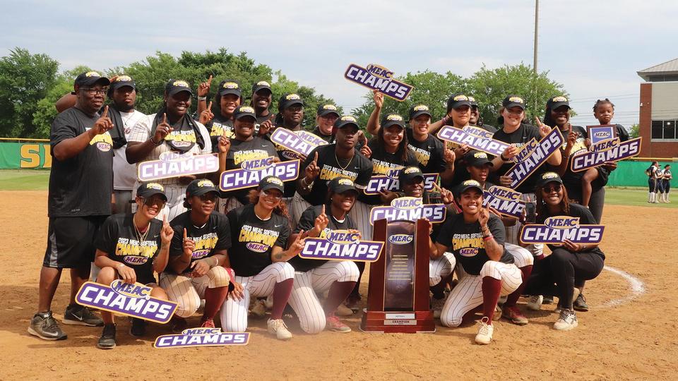 NCCU athletic team holding MEAC Champs sign