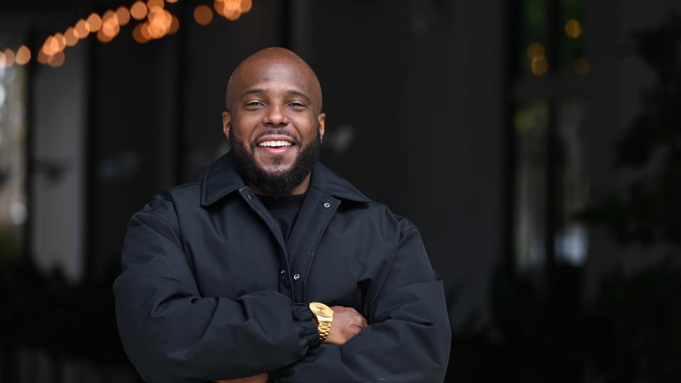 Kwame Molden in black attire