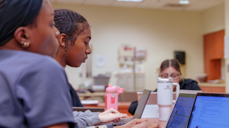 Nursing Student using Apple Macbook