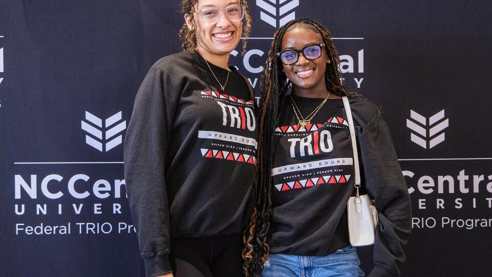 Two female students smiling.