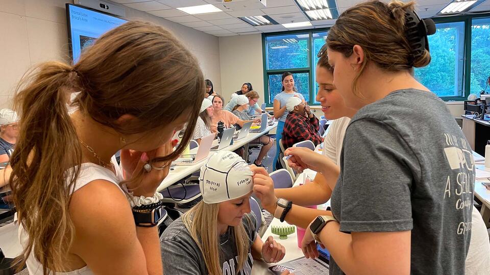 students labeling a head
