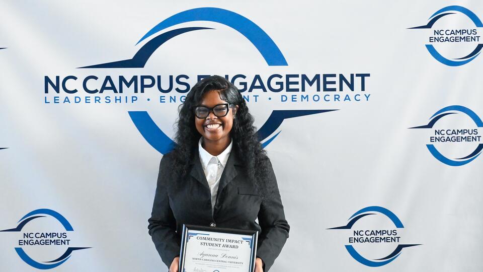 Ayanna Dennis holds certificate