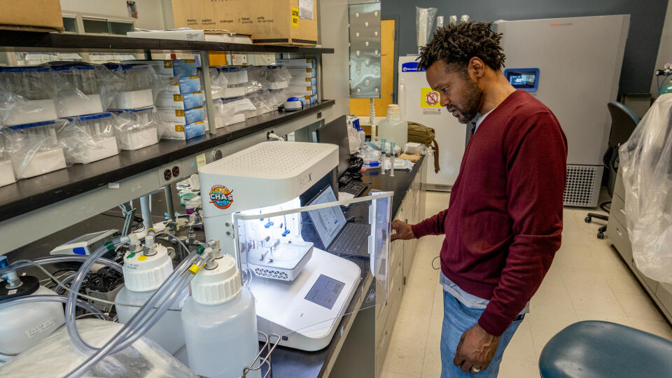 Fab Lab Director Eric Saliim operates bioprinting machine