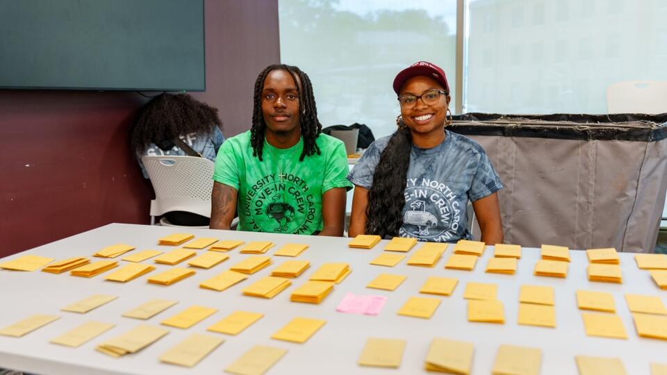 Students Sitting Infront of Sticky Notes Table