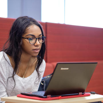 NCCU student using a computer.