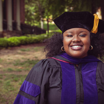 Law School graduate Brittany Reaves standing in front of building