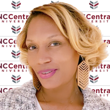 Dr. Darlene Eberhardt-Burke in front of NCCU logo