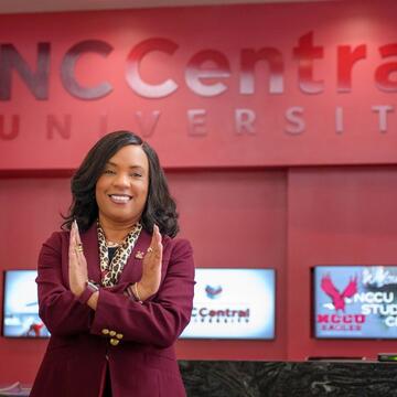 Chancellor Dixon standing in front of Student Center desk