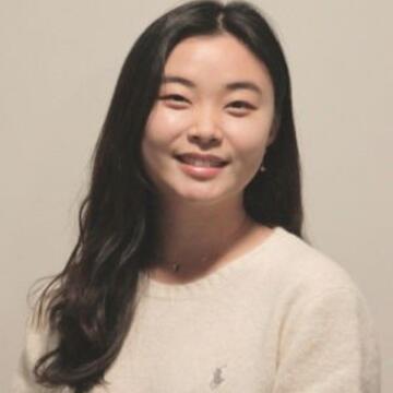 Professional portrait of Jiyoung Park smiling and wearing a light-colored sweater.