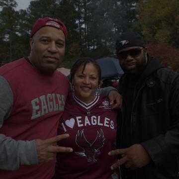 Three Alumni posing for a picture together