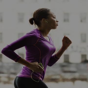 Lady running in purple shirt