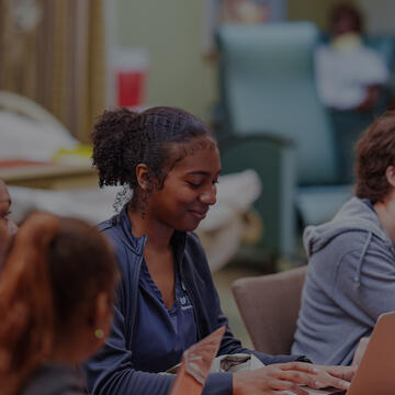 nursing student on apple product