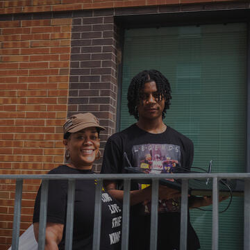 A parent helping a student move in