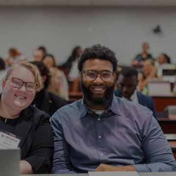 two people smiling