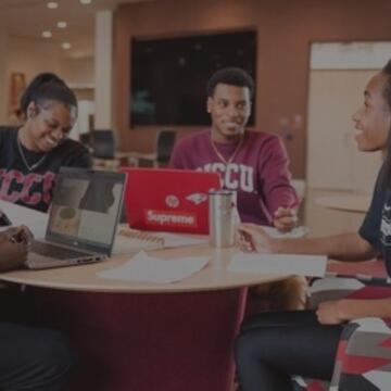 Students sitting at a round table