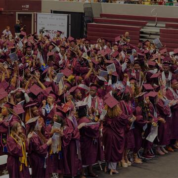 North Carolina Central University 147th Commencement Exercises undergraduate ceremony flyer featuring graduate in maroon regalia, May 9, 2026 with ceremony times at McDougald-McLendon Arena.
