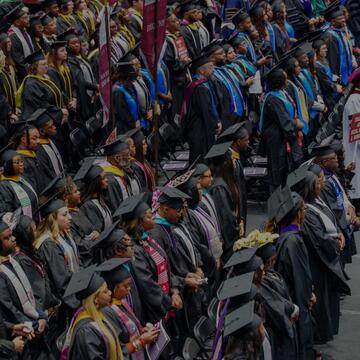 North Carolina Central University 147th Commencement Exercises graduate ceremony flyer with smiling graduate in cap and gown, May 8, 2026 at McDougald-McLendon Arena.
