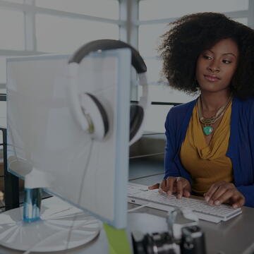 Woman sitting in front of a computer